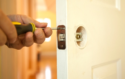 Handyman in Mt Baldy, CA fixing door.